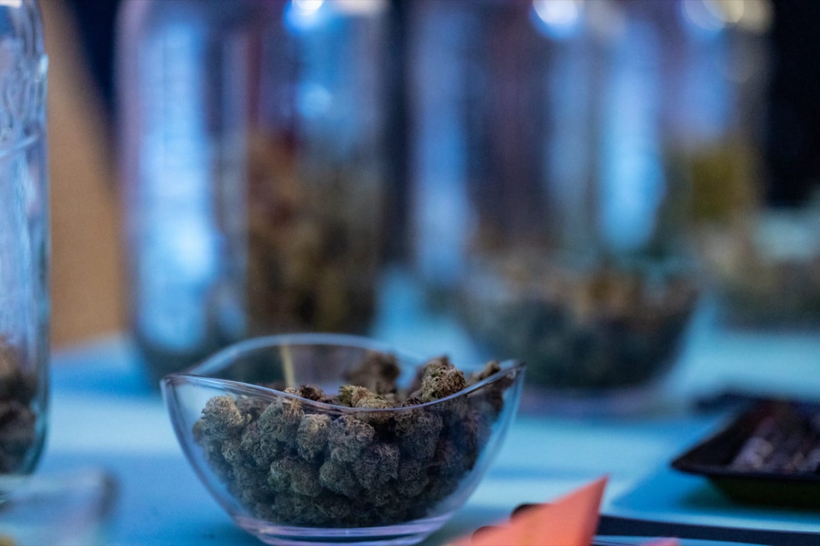 Cannabis flower buds in a glass bowl at Beleaf Brooklyn grand opening